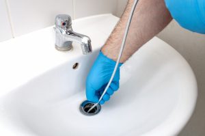 drain-snake-in-bathroom-sink